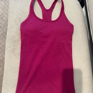 Lululemon ribbed racerback tank top with padded shelf bra. Size 2. Magenta.